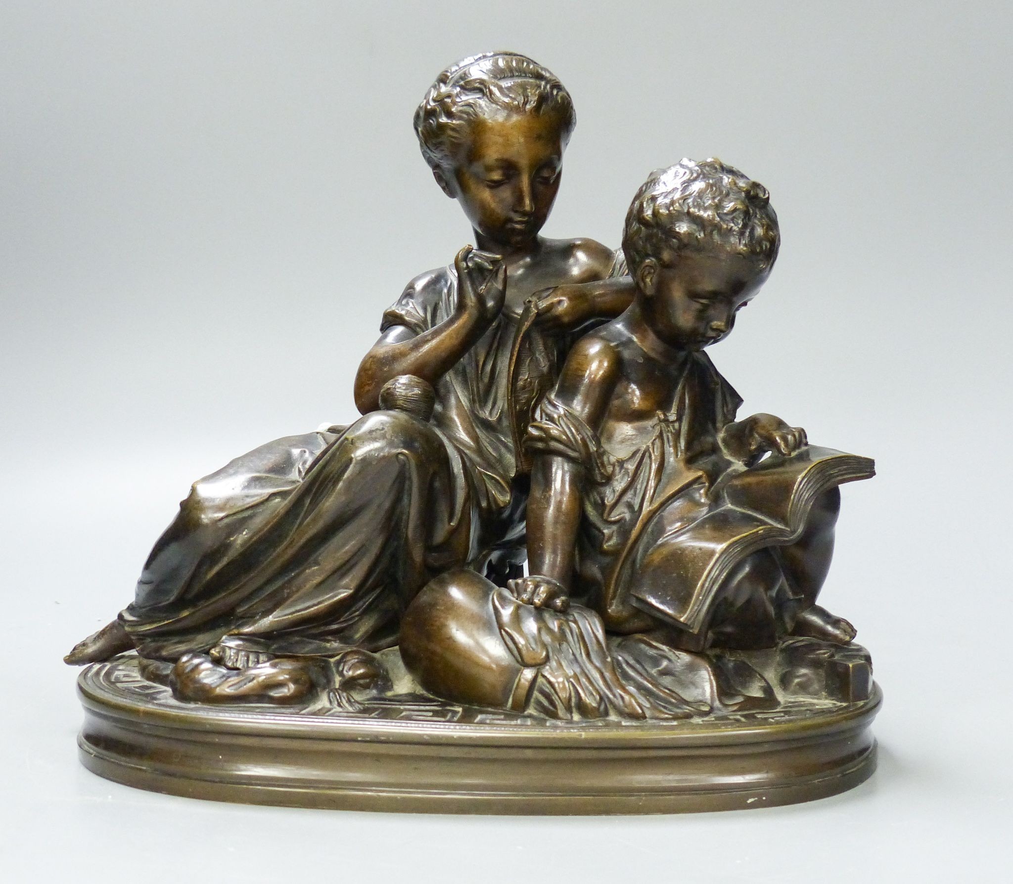 A 19th century bronze figure group of a mother and child 25cm